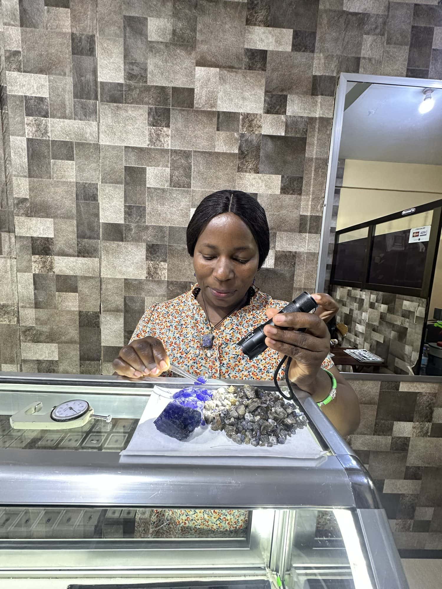 Grading rough tanzanite under the torch at our counter